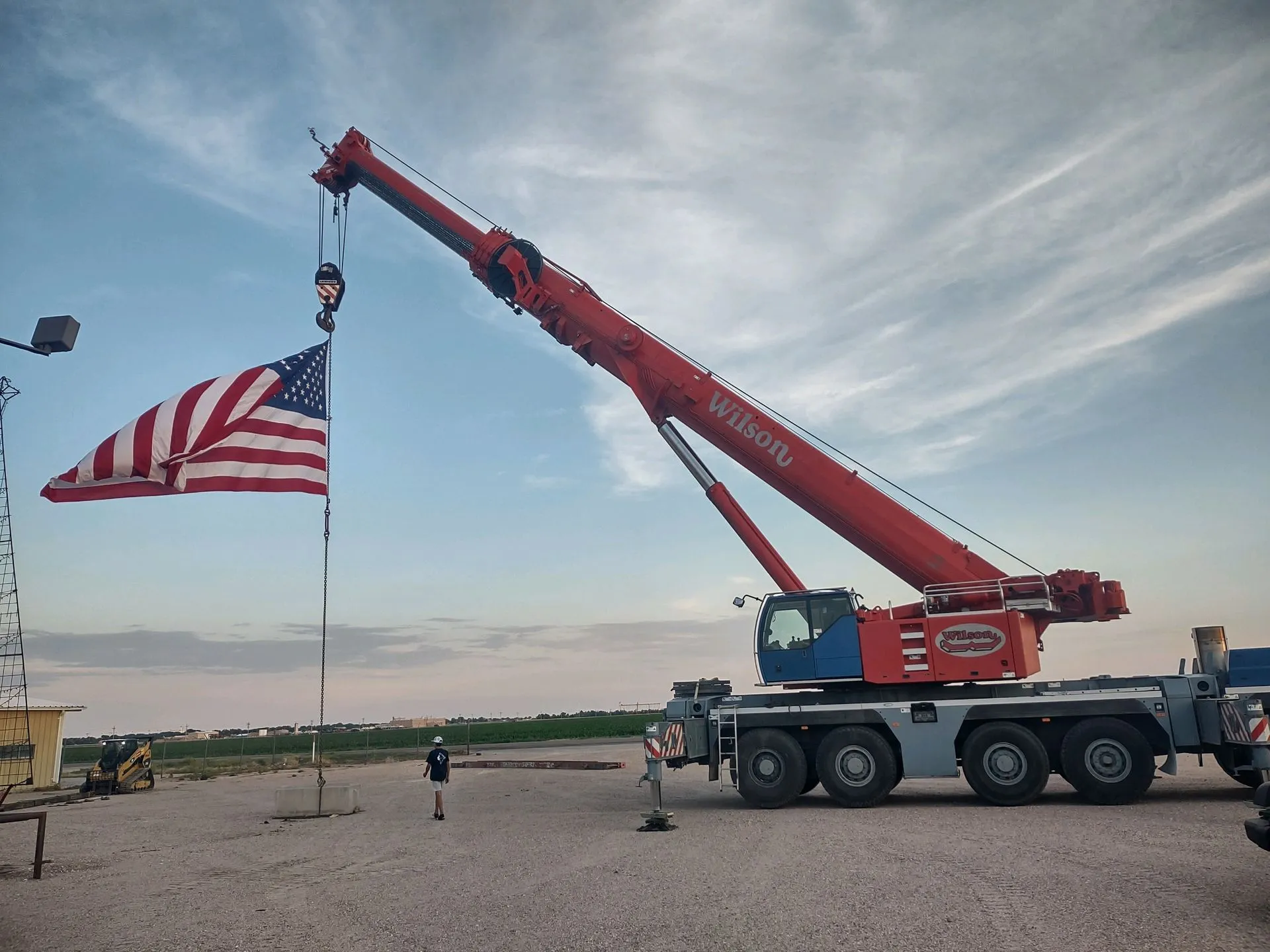 Wilson crane flying an American flag from its boom